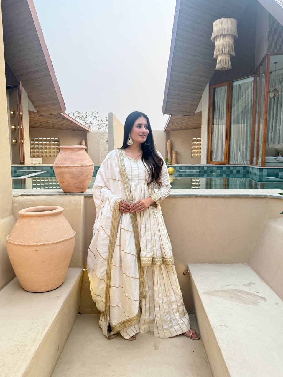 Radiant Rose Pink Flared Peplum Kurti and Sharara Set Embellished with Luminous Gold Zari Stripes and Sequined Borders